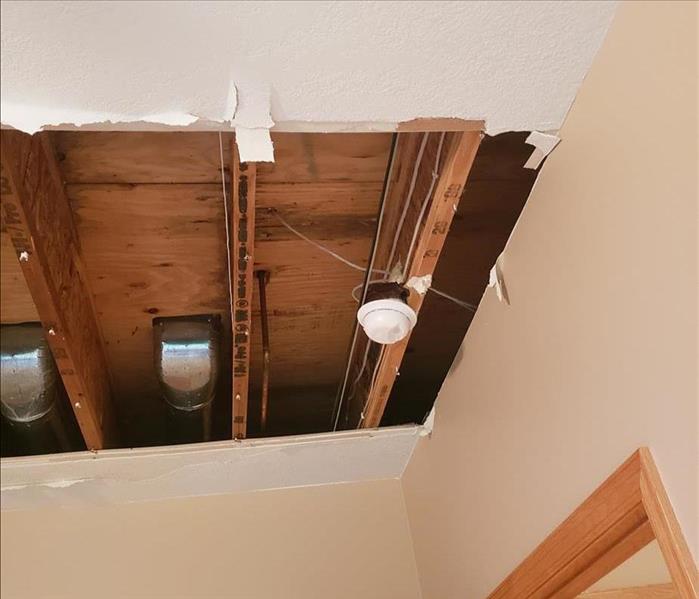 a hole in the ceiling from water damage
