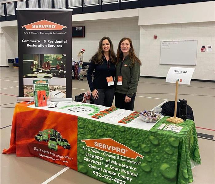 aimee and tierney hosting a booth at the shakopee career expo